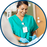 Nurse smiling over patient