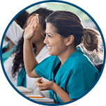 Nurse student smiling and raising hand in class