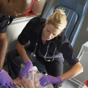 EMTs working on patient in ambulance