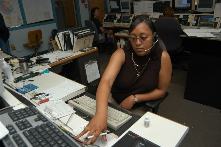 Female dispatcher on a call Female dispatcher on a call