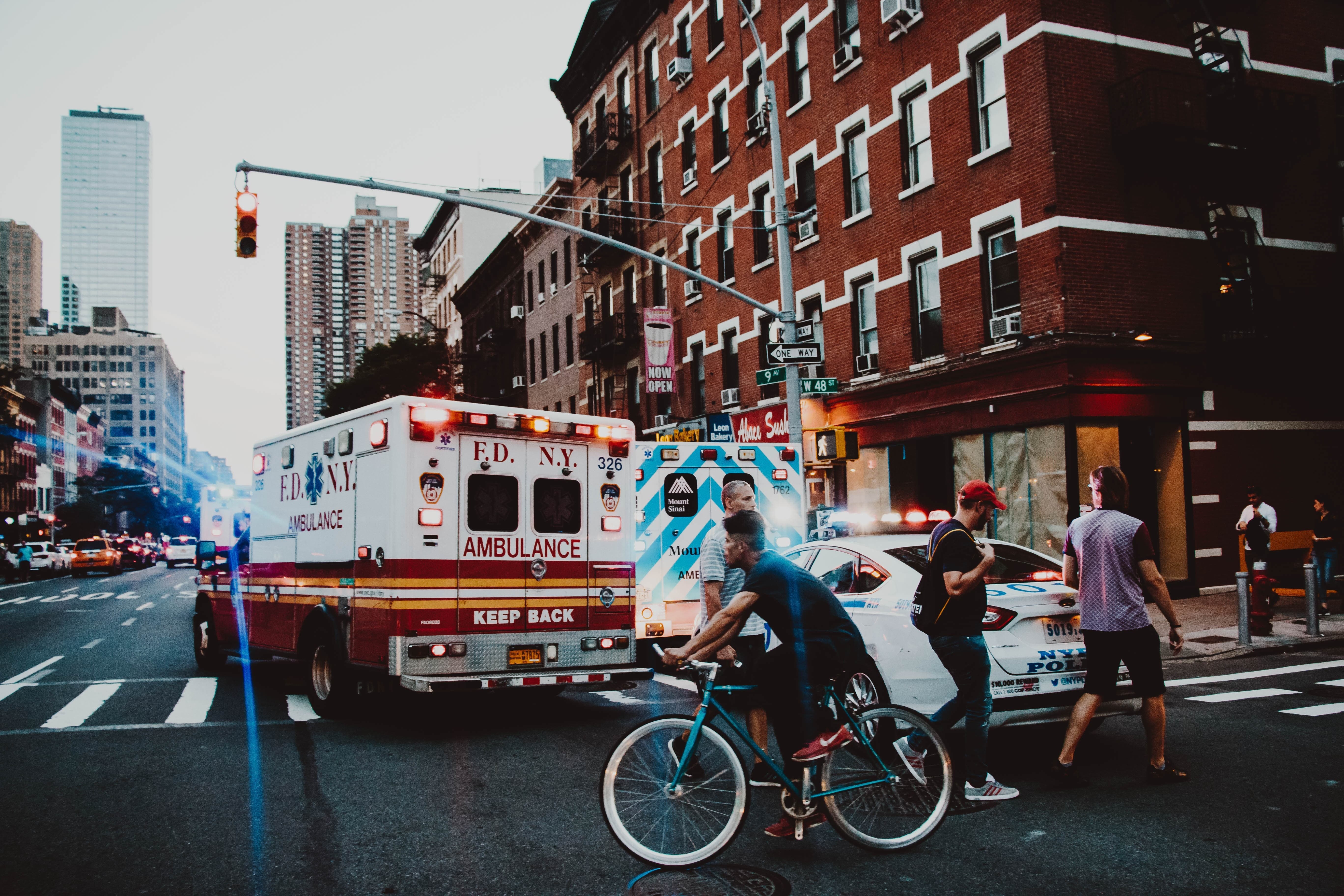 Ambulance on a crowded street corner