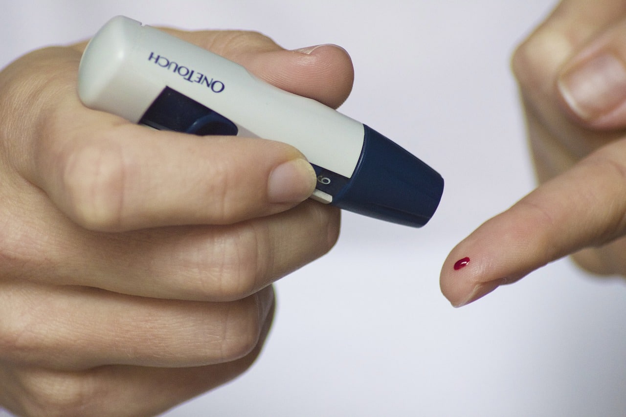 Diabetic testing their blood sugar levels