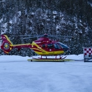 A helicopter landing in snow