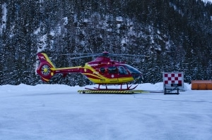 A helicopter landing in snow