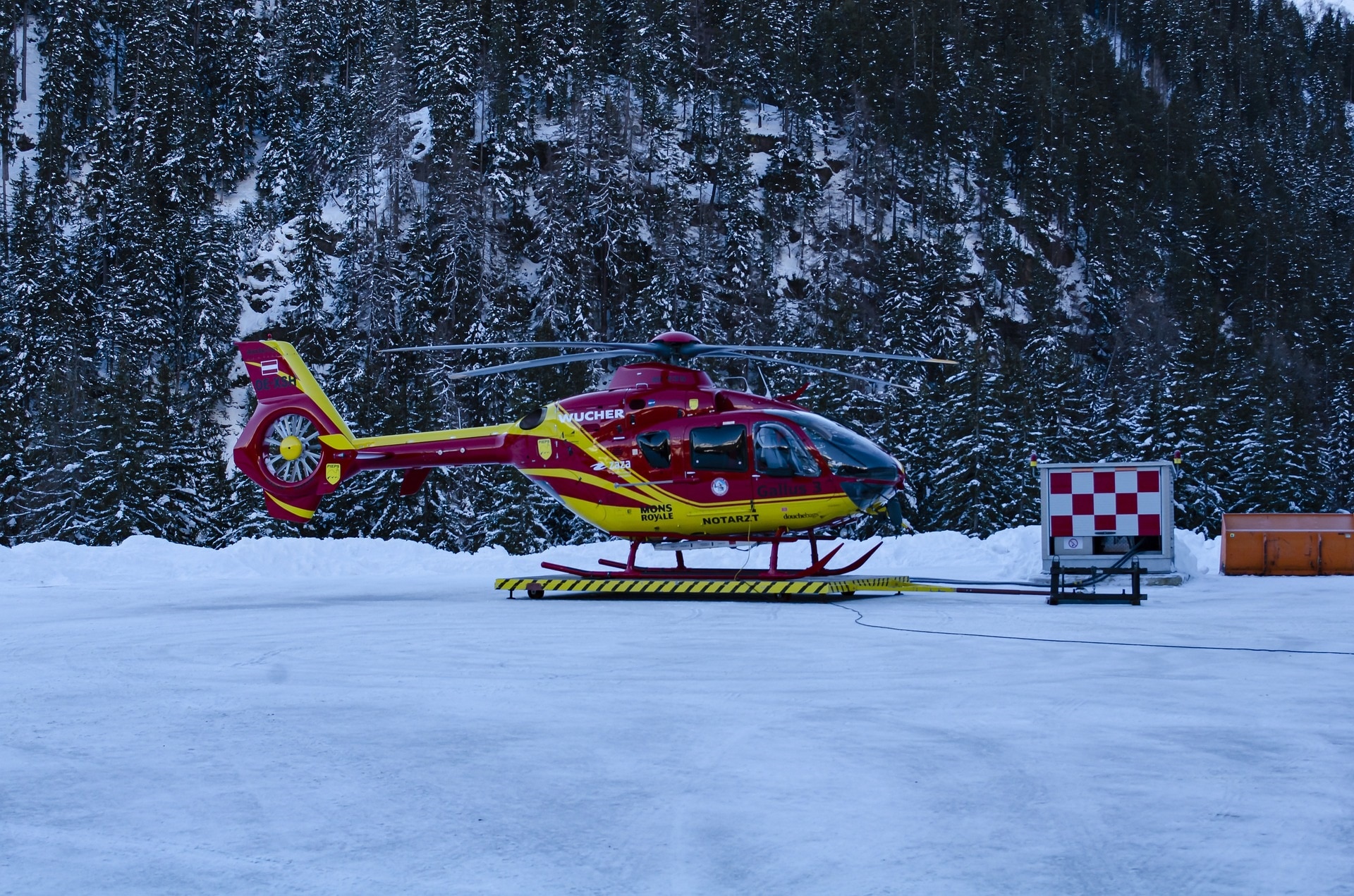 A helicopter landing in snow