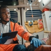 African-American paramedic with a patient