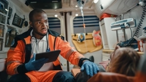 African-American paramedic with a patient