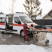 Paramedics transporting a patient in the snow