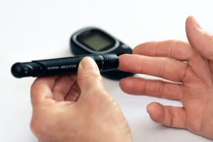 Diabetic person testing their blood sugar levels