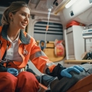 Female EMS professional comforting a man