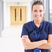 Female healthcare professional in a hallway