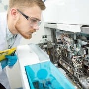 Male professional examining medical equipment