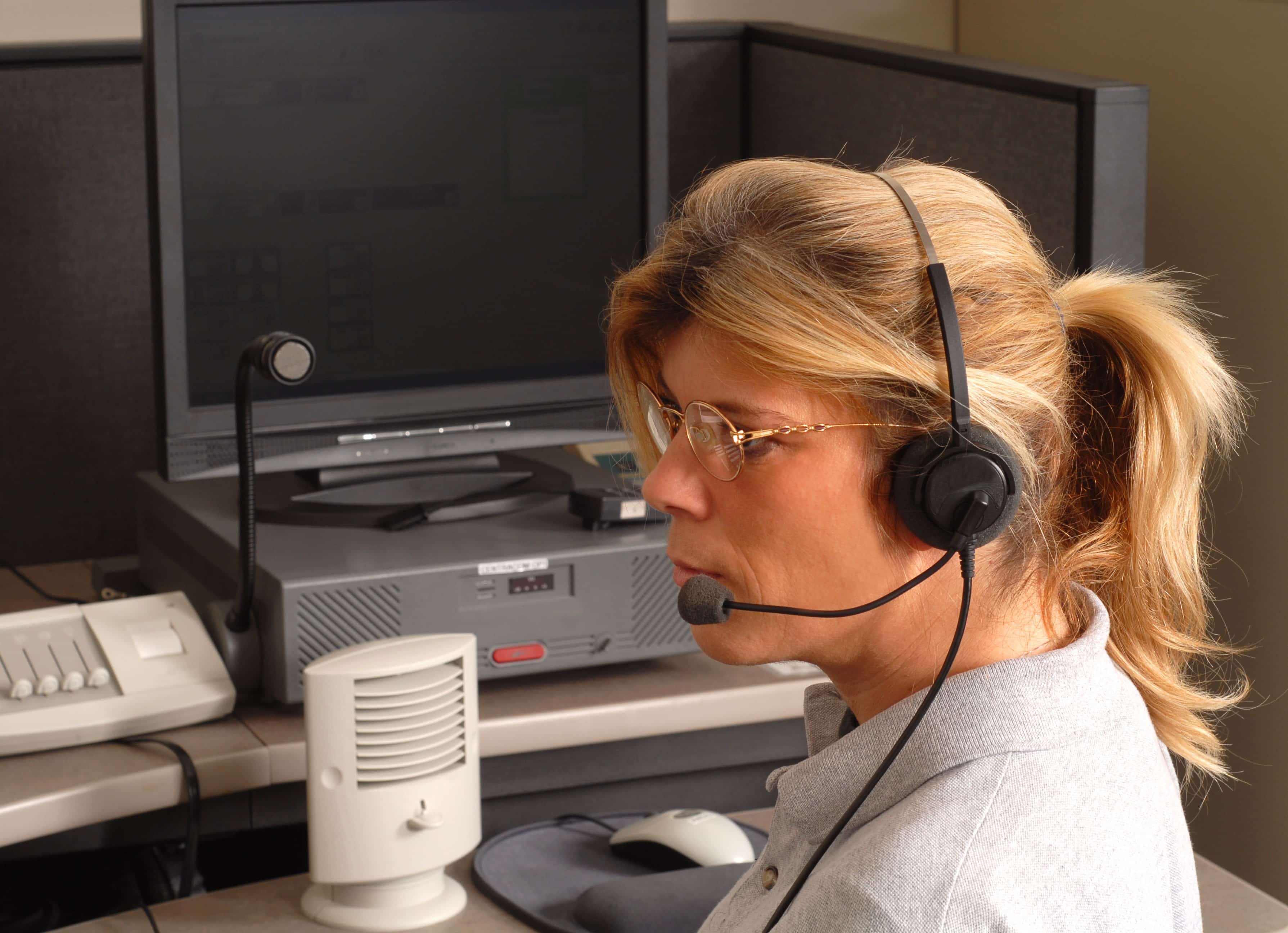 Police dispatcher with a headset on