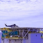 View of offshore platform with helicopter