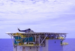 View of offshore platform with helicopter