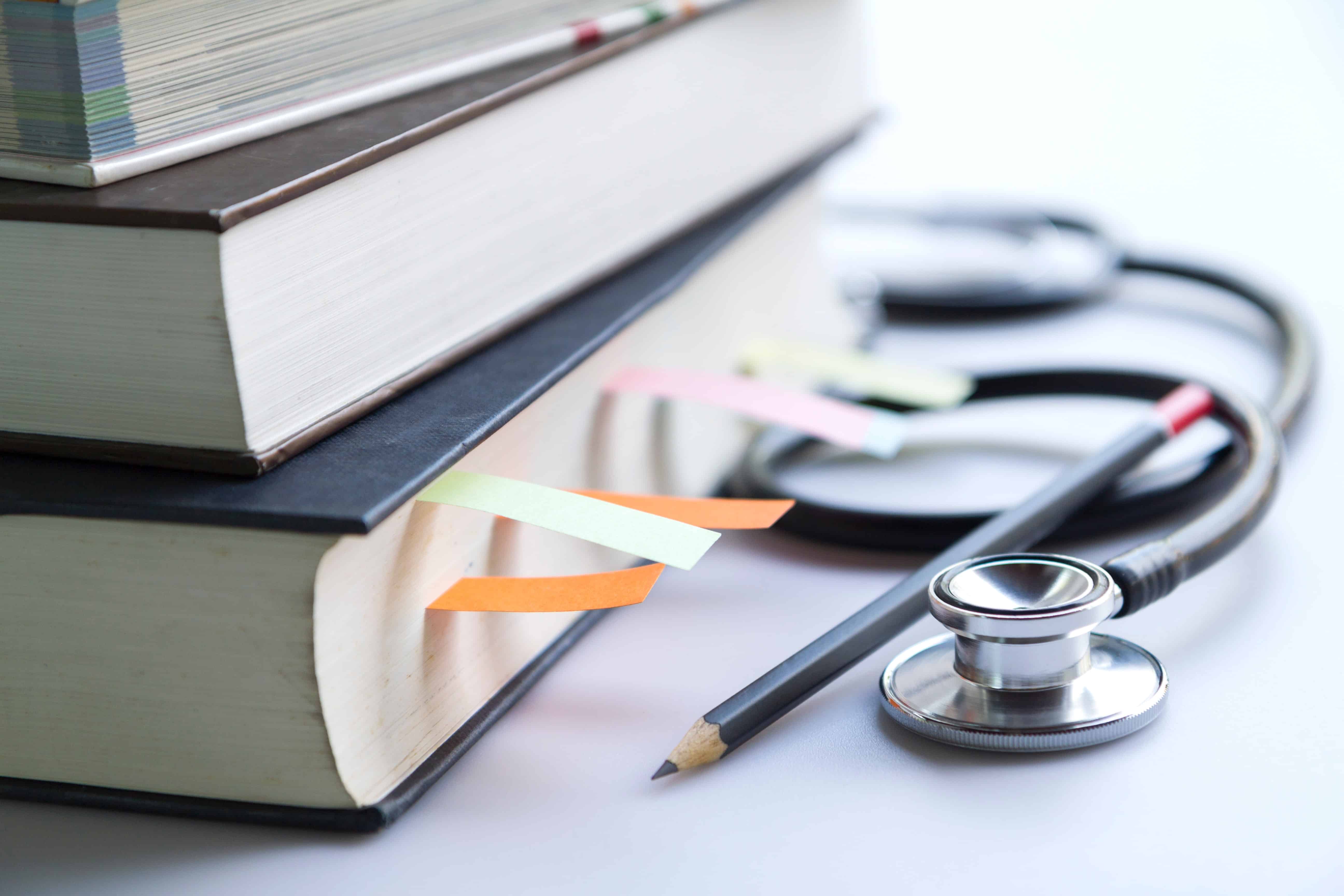 Close up of stethoscope and textbooks