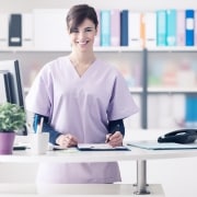 Female medical professional working at a desk