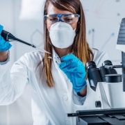 Forensic technician performing lab tests