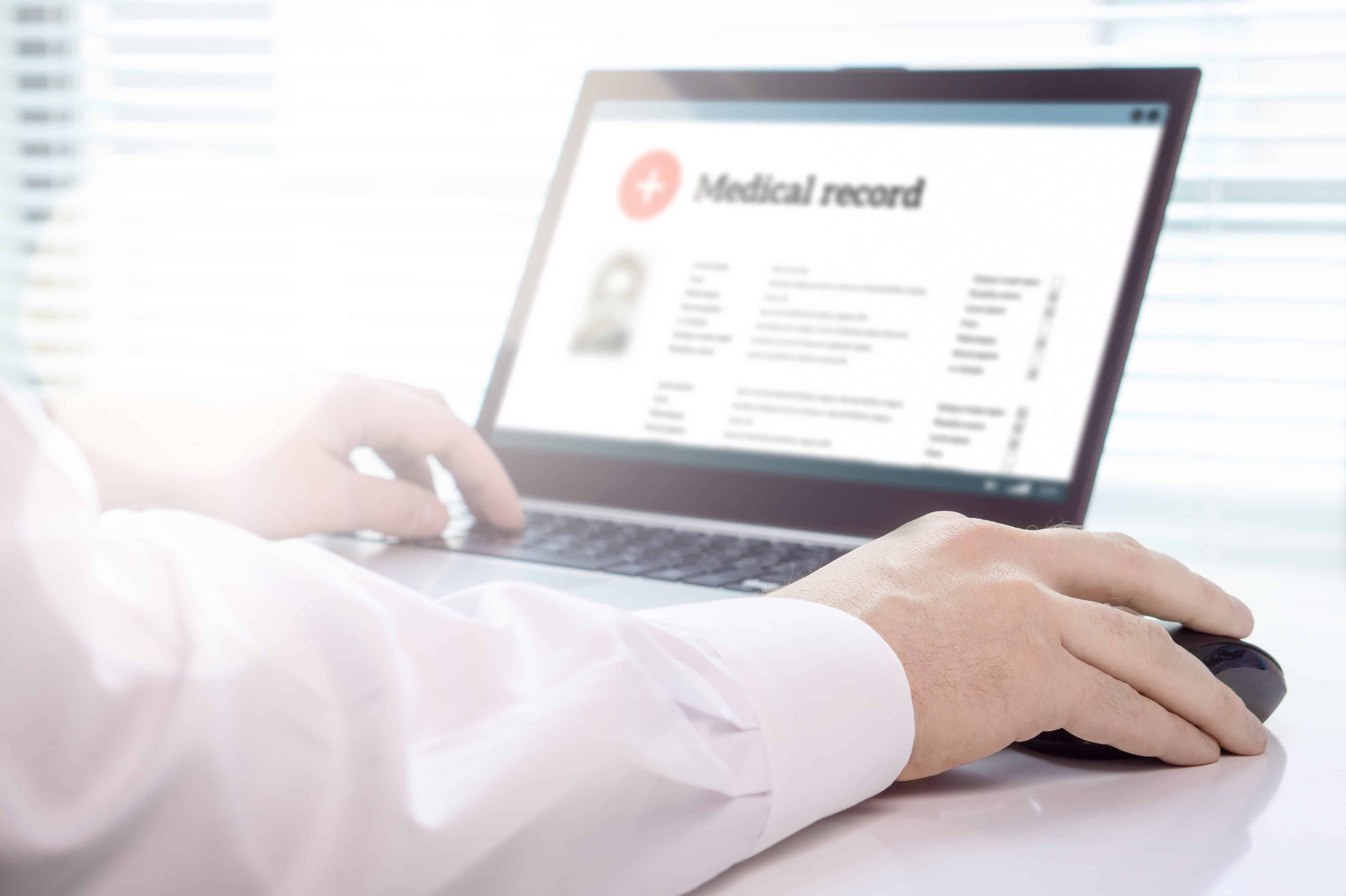 Health professional looking at medical records