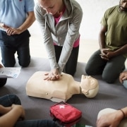 CPR training class with a mannequin
