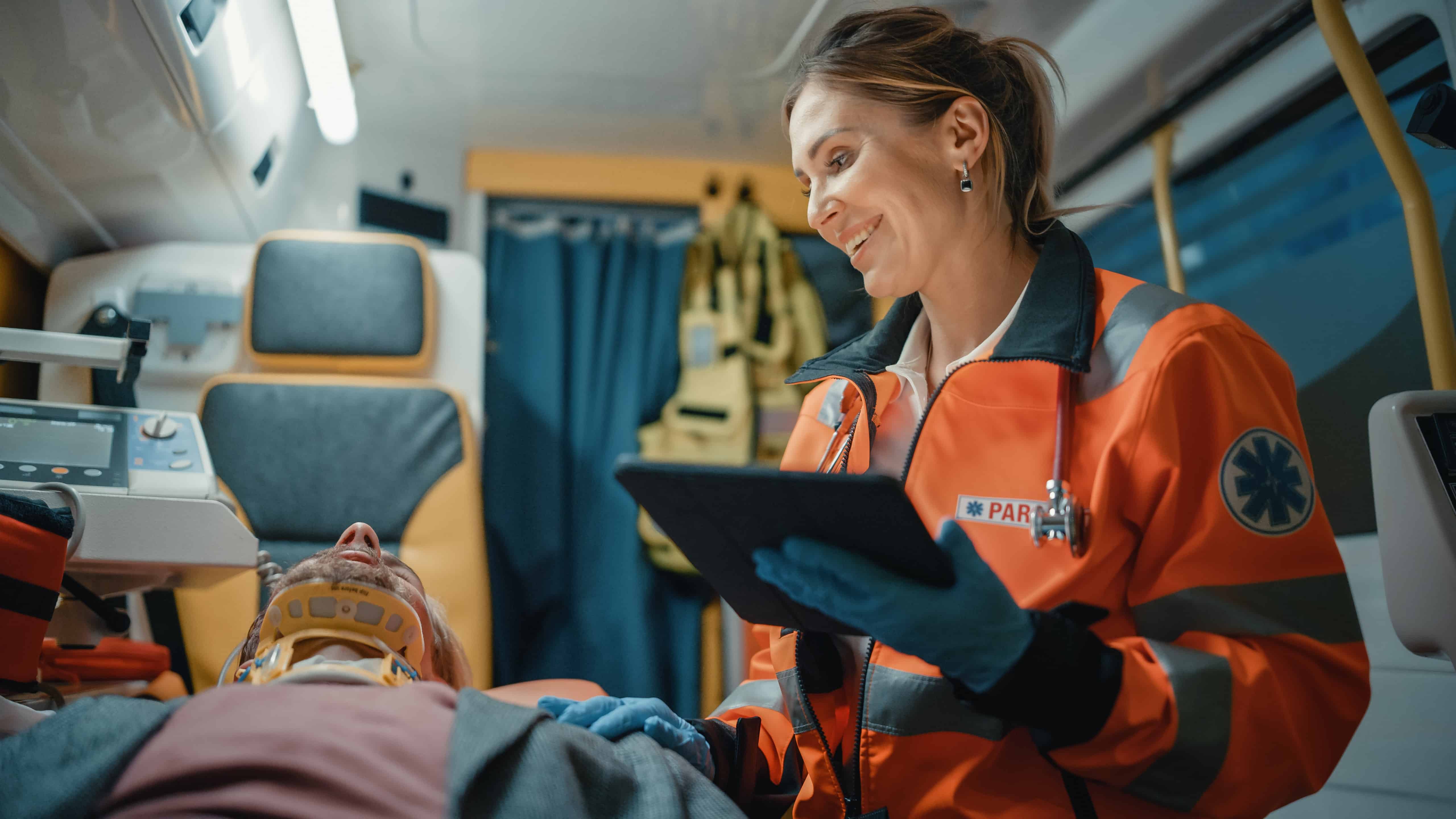 Female EMS professional using a tablet