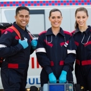 Group of EMS professionals next to ambulance