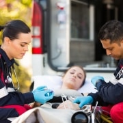 EMS professionals assisting a woman