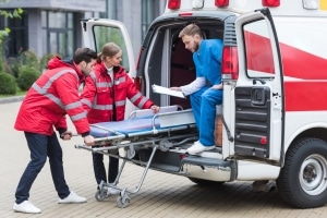 EMS professionals moving a stretcher