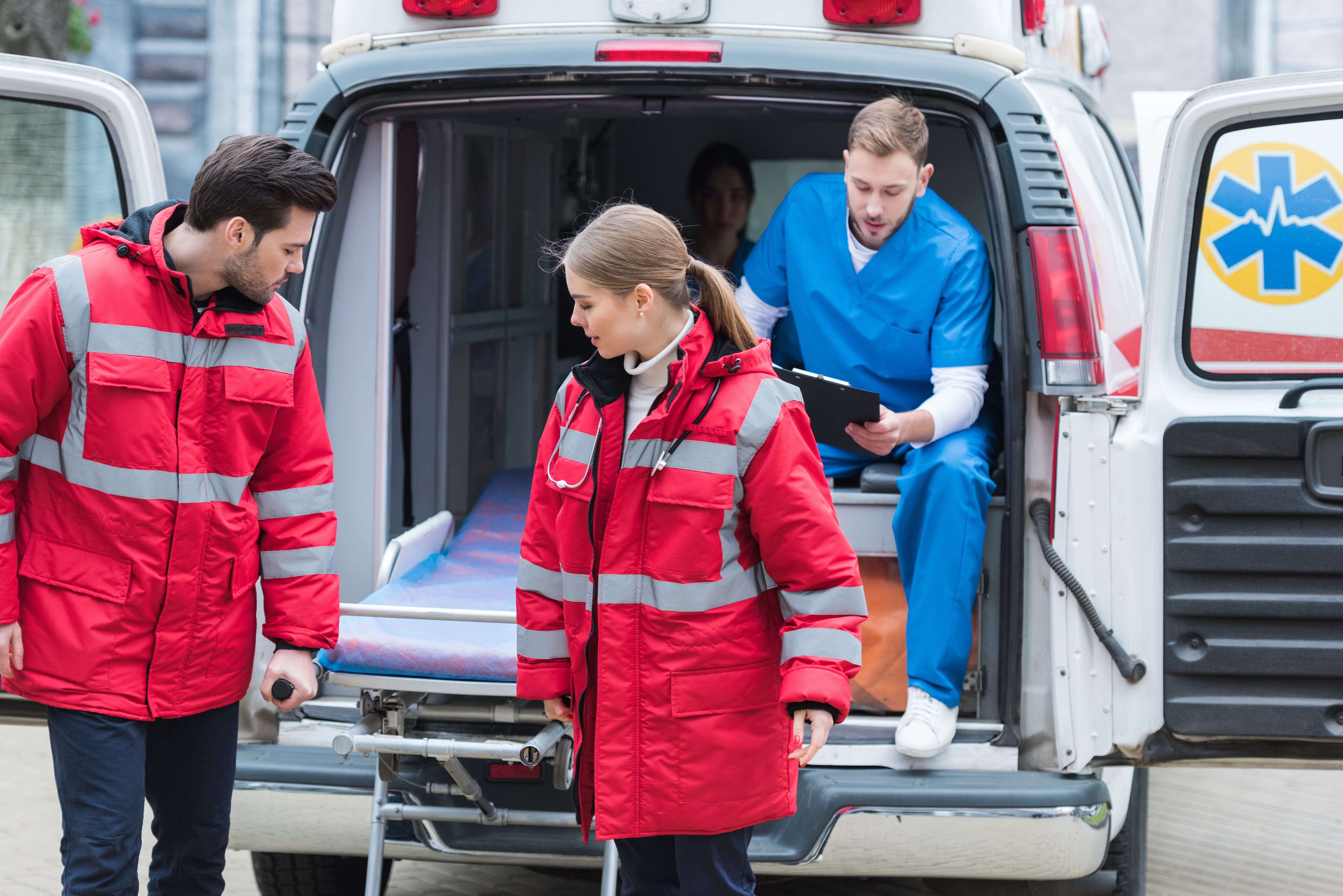 EMS professionals moving equipment