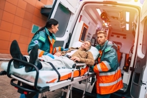 EMS professionals transporting a stretcher