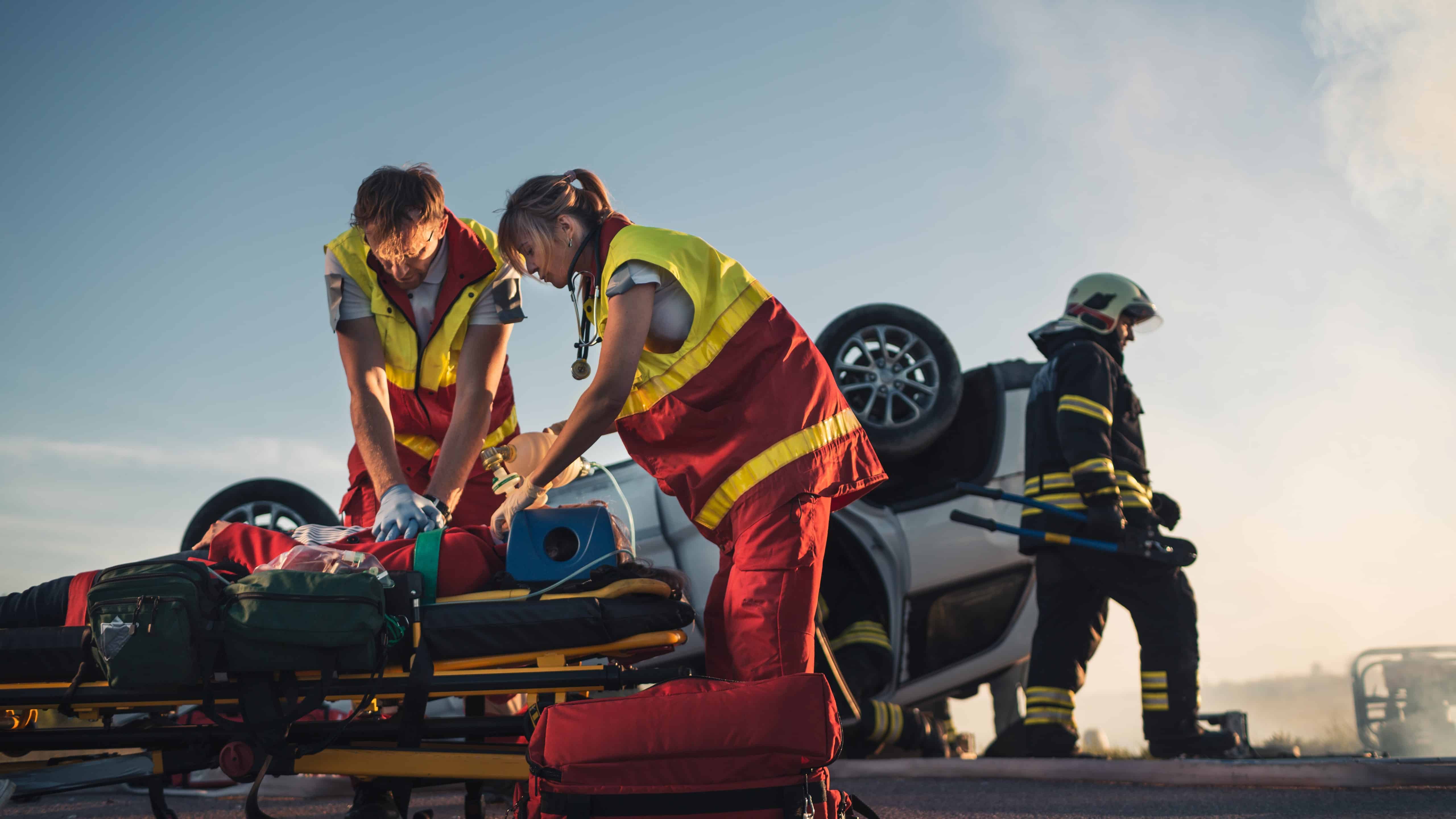 EMS workers at the site of a car crash