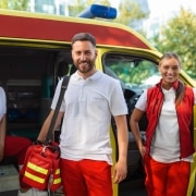 Three smiling EMS professionals