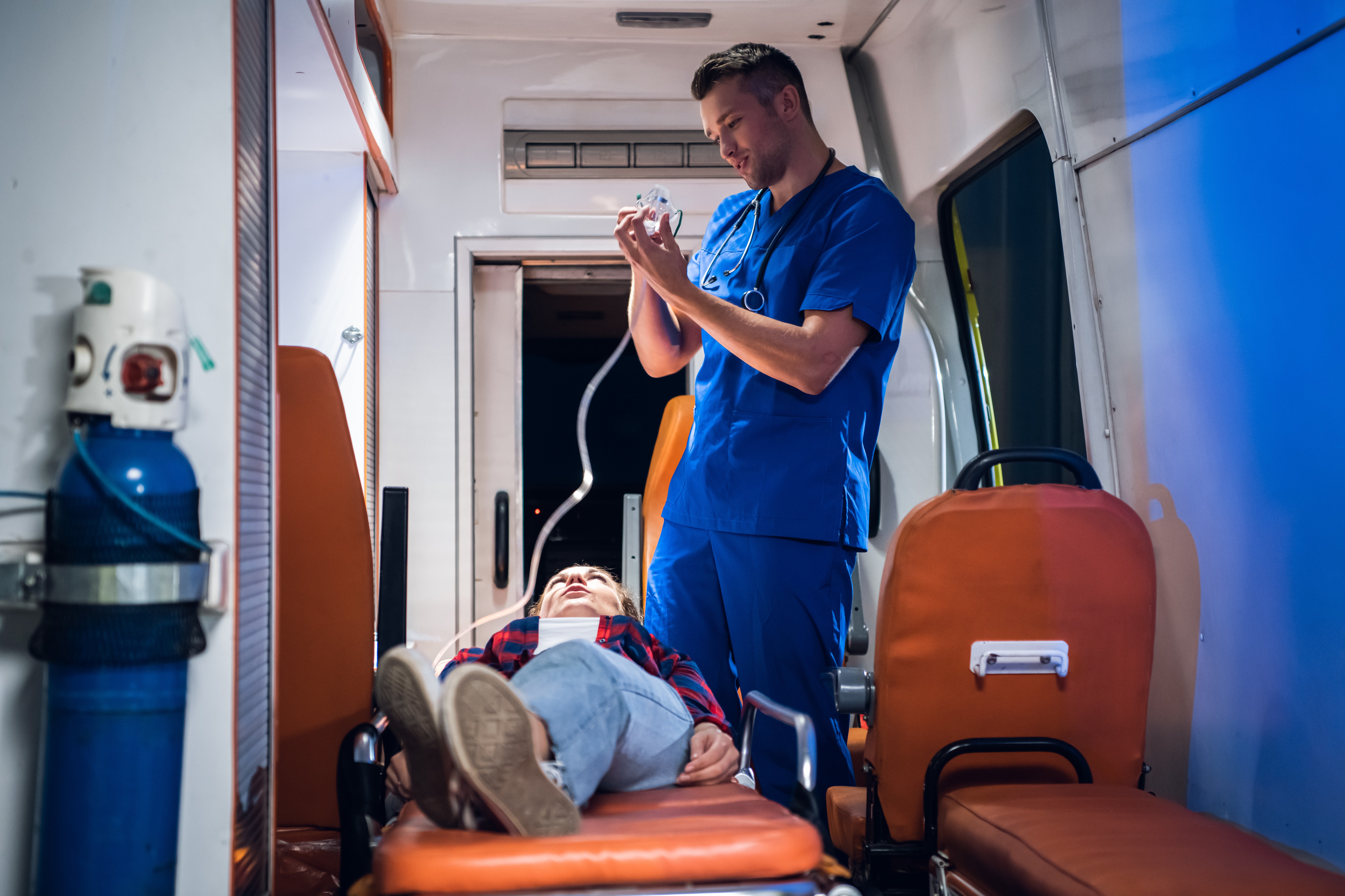 Medical professional on an ambulance with a patient
