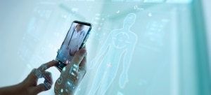 Concept of telemedicine with close up of a person's hands and smartphone