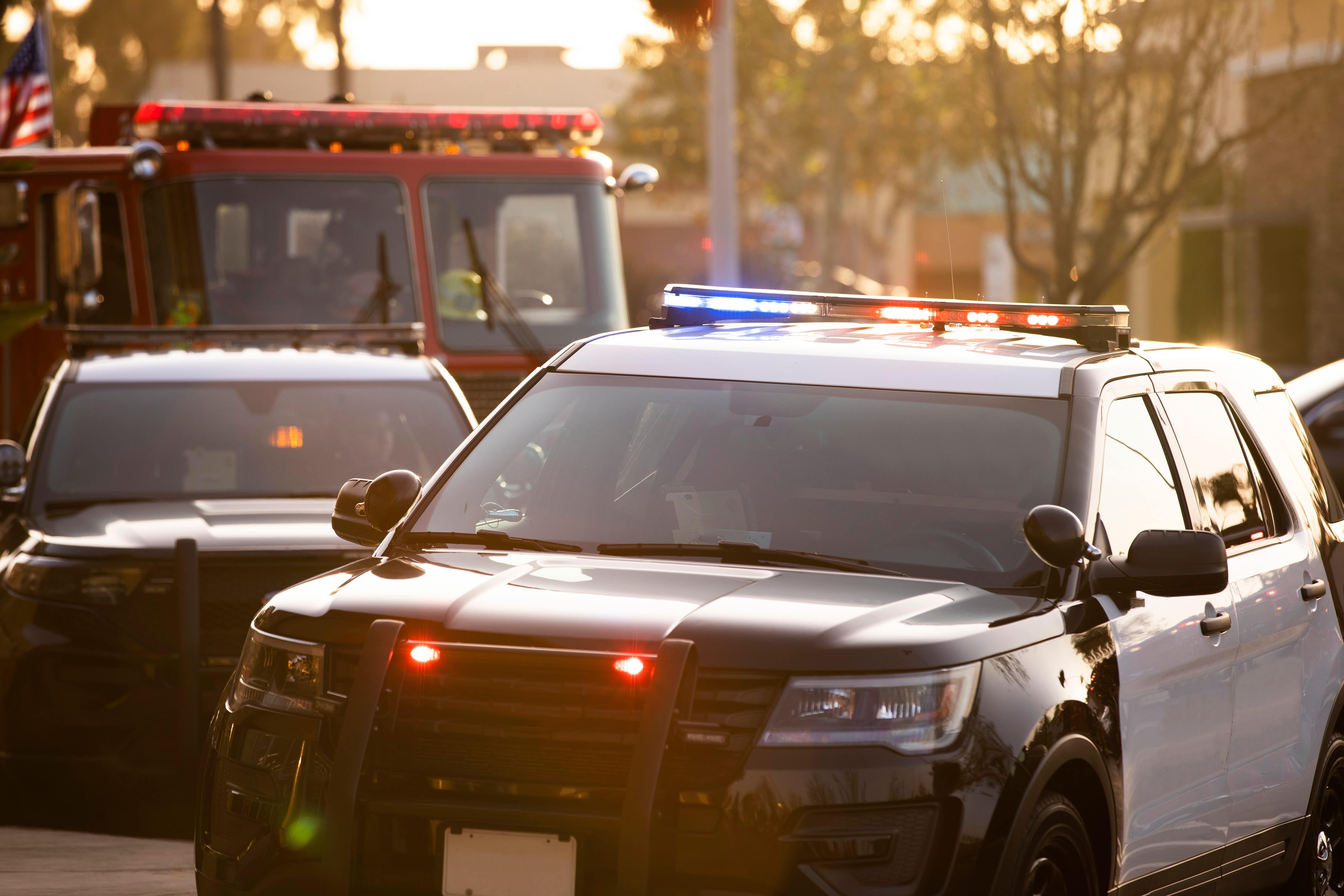 Close up of police cars and a fire truck